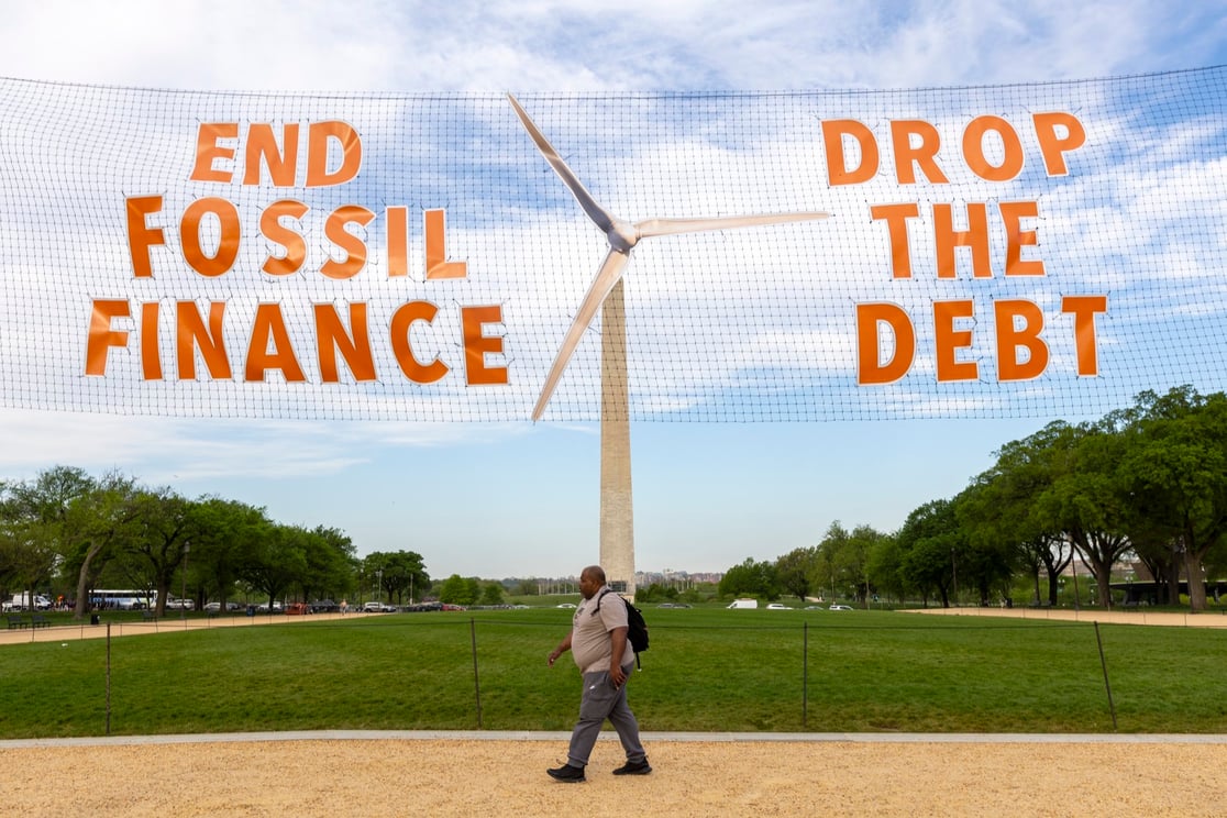 Activists welcome World Bank leaders into DC dramatically, by transforming the Washington Monument into a massive wind turbine. Source: Glasgow Actions Network
